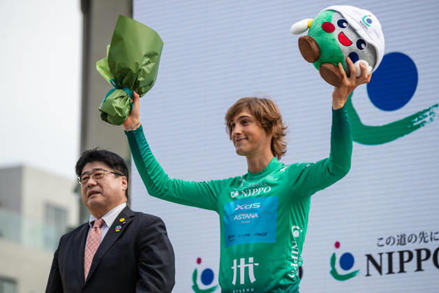 Tour De Kyushu Stage Finishes In Fukuoka s Tenjin For The First Time Matteo Malucelli of XDS Astana Team wins Stage 1 of the Mynavi Tour de Kyushu 2026 at the finish line on Tenjin Bridge in Fukuoka, Japan, on October 10, 2026. The Italian won the 152.0-kilometer Saga-Fukuoka stage in 3 hours 9 minutes 51 seconds, ahead of Luke Mudgway (Li Ning Star) and Alessio Delle Vedove (XDS Astana Team), and took the general and points classification leads. It was the first time the race finished in Tenjin, the commercial heart of Fukuoka, where a parade, stage events and food stalls marked the day. The race, first held in 2023 and part of the UCI Asia Tour (2.1 category), runs October 9-12 through six Kyushu prefectures under the official title We stand with Kumamoto. Mynavi Tour de Kyushu 2026, adopted to support areas affected by the Kumamoto earthquake. Fukuoka Japan  Copyright: xRyoxChix originalFilename:zhi-tourdeky261010_np6um