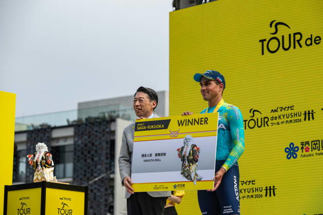 Tour De Kyushu Stage Finishes In Fukuoka s Tenjin For The First Time Matteo Malucelli of XDS Astana Team wins Stage 1 of the Mynavi Tour de Kyushu 2026 at the finish line on Tenjin Bridge in Fukuoka, Japan, on October 10, 2026. The Italian won the 152.0-kilometer Saga-Fukuoka stage in 3 hours 9 minutes 51 seconds, ahead of Luke Mudgway (Li Ning Star) and Alessio Delle Vedove (XDS Astana Team), and took the general and points classification leads. It was the first time the race finished in Tenjin, the commercial heart of Fukuoka, where a parade, stage events and food stalls marked the day. The race, first held in 2023 and part of the UCI Asia Tour (2.1 category), runs October 9-12 through six Kyushu prefectures under the official title We stand with Kumamoto. Mynavi Tour de Kyushu 2026, adopted to support areas affected by the Kumamoto earthquake. Fukuoka Japan  Copyright: xRyoxChix originalFilename:zhi-tourdeky261010_np9X6