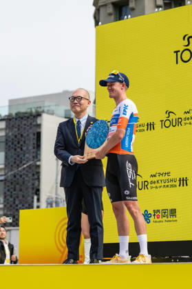 Tour De Kyushu Stage Finishes In Fukuoka s Tenjin For The First Time Matteo Malucelli of XDS Astana Team wins Stage 1 of the Mynavi Tour de Kyushu 2026 at the finish line on Tenjin Bridge in Fukuoka, Japan, on October 10, 2026. The Italian won the 152.0-kilometer Saga-Fukuoka stage in 3 hours 9 minutes 51 seconds, ahead of Luke Mudgway (Li Ning Star) and Alessio Delle Vedove (XDS Astana Team), and took the general and points classification leads. It was the first time the race finished in Tenjin, the commercial heart of Fukuoka, where a parade, stage events and food stalls marked the day. The race, first held in 2023 and part of the UCI Asia Tour (2.1 category), runs October 9-12 through six Kyushu prefectures under the official title We stand with Kumamoto. Mynavi Tour de Kyushu 2026, adopted to support areas affected by the Kumamoto earthquake. Fukuoka Japan  Copyright: xRyoxChix originalFilename:zhi-tourdeky261010_npGhA