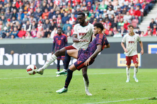 Chrislain Matsima 5, FC Augsburg, and Luis Diaz 14, FC Bayern Munich, during the match between FC Augsburg and FC Bayern Munich, soccer, men s, Bundesliga, 2026–2027, Matchday 5 on October 10, 2026, in Augsburg, WWK ARENA. DFL and DFB regulations prohibit any use of photographs as image sequences and or quasi-video. Bavaria, Germany