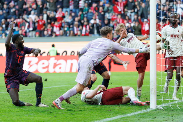Hennes Behrens (16), FC Augsburg, and Finn Dahmen (1), FC Augsburg, make a save on the goal line during the match between FC Augsburg and FC Bayern Munich, soccer, men’s, Bundesliga, 2026–2027, Matchday 5 on October 10, 2026, in Augsburg, WWK ARENA. DFL and DFB regulations prohibit any use of photographs as image sequences and or quasi-video. Bavaria, Germany