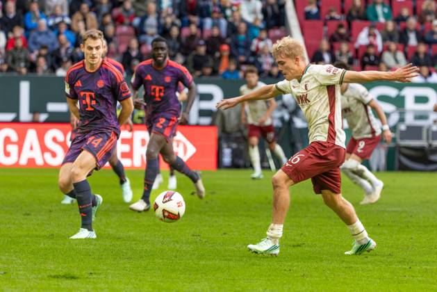 Josip Stanisic of FC Bayern Munich and Hennes Behrens of FC Augsburg (left) in a tackle, FC Augsburg vs. FC Bayern Munich, Bundesliga Soccer, Soccer, Bundesliga 1, Matchday 5, October 10, 2026. DFL regulations prohibit any use of photographs as image sequences and or quasi-video. Copyright: xkolbert-press PeterxFastlx