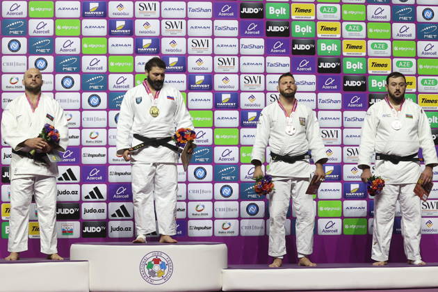 AZERBAIJAN, BAKU - OCTOBER 10, 2026: Azerbaijan s Ushangi Kokauri, Russia s Inal Tasoev, Czechia s Lukas Krpalek and Azerbaijan s Kanan Nasibov (L-R) celebrate their silver, gold and two bronze medals respectively during a victory ceremony for the men s heavyweight event as the 2026 World Judo Championships takes place at the National Gymnastics Arena. Mikhail Sinitsyn TASS  99050473