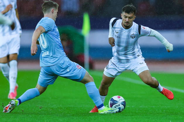 FC Zurich vs. FC Thun, Brack Super League, October 10, 2026. Nico Maier (30), FC Thun, left, in a tackle with Bledian Krasniqi (7), FC Zurich during the Brack Super League soccer match between FC Zurich and FC Thun on October 10, 2026, at Letzigrund Stadium, Zurich, Switzerland Zurich Letzigrund Stadium Zurich Switzerland