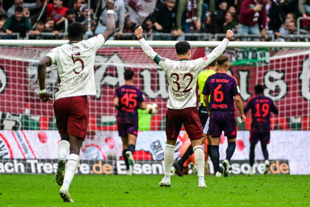 October 10, 2026, GER, Soccer, Men s, 1st Bundesliga, Matchday 5, FC Augsburg vs. FC Bayern Munich: Augsburg players celebrate after scoring the 2–1 goal; Chrislain Matsima (FC Augsburg, 5), Fabian Rieder (FC Augsburg, 32); Augsburg WWK Arena, Bayern, Germany Copyright: xNordphotox xHafnerx