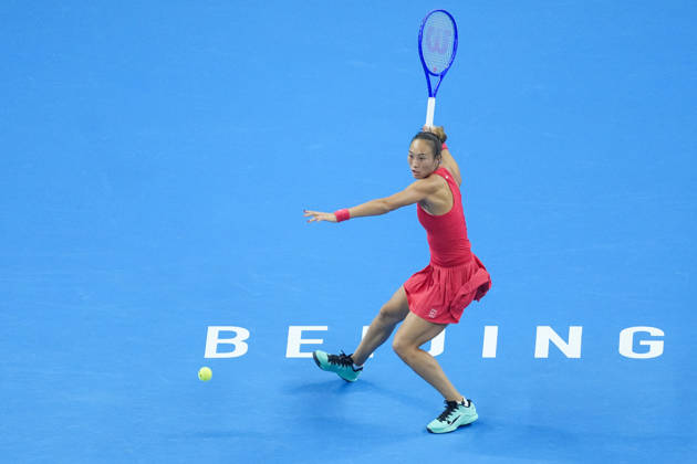 (261010) -- BEIJING, Oct. 10, 2026 -- Zheng Qinwen hits a return during the women s singles semifinal between Zheng Qinwen of China and Elise Mertens of Belgium at 2026 China Open tennis tournament in Beijing, China, Oct. 10, 2026. ) (SP)CHINA-BEIJING-TENNIS-CHINA OPEN-WOMEN S SINGLES-SEMIFINAL (CN) JuxHuanzong