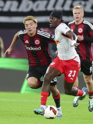 Ritsu Doan of Eintracht Frankfurt and Castello Lukeba of RB Leipzig battle for the ball during the Bundesliga match between RB Leipzig and Eintracht Frankfurt, Red Bull Arena on October 10, 2026, in Leipzig, Germany. Photo by Marco Steinbrenner, DeFodi Images. Ritsu Doan of Eintracht Frankfurt and Castello Lukeba of RB Leipzig battle for the ball during the Bundesliga match between RB Leipzig and Eintracht Frankfurt at Red Bull Arena on October 10, 2026 in Leipzig, Germany. Photo by Marco Steinbrenner, DeFodi Images. DFB and DFL regulations prohibit any use of photographs as image sequences and or quasi-video. Photo by Marco Steinbrenner, DeFodi Images