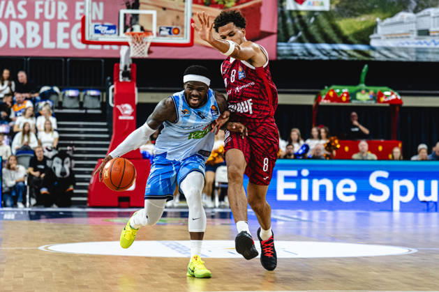 Rostock, Germany, October 10, 2026, easyCredit BBL 2026–2027, Game Day 5: Rostock Seawolves vs. Fitness First Würzburg Baskets. Pictured, from left, in a one-on-one matchup: TJ Crockett Jr. of the Rostock Seawolves and Brandon Tischler of the Fitness First Würzburg Baskets. Copyright: xFotostandx xVoelkerx