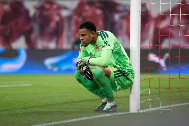 1 German Bundesliga: RB Leipzig vs. Eintracht Frankfurt, October 10, 2026; Goalkeeper Noah Atubolu 1; Eintracht Frankfurt player crouches by the goalpost; LEIPZIG, GERMANY OCTOBER 10 Bundesliga match between RB Leipzig and Eintracht Frankfurt at the Red Bull Arena on Matchday 5 of the 1. Bundesliga on October 10, 2026 in Leipzig, Germany. DFL regulations prohibit any use of photographs as image sequences and or quasi-video. Copyright: xBEAUTIFULxSPORTS JanxKaeferx