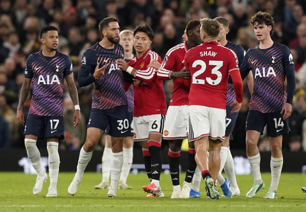 Manchester, England, 10th October 2026. Rodrigo Bentancur of Tottenham Hotspur (2L) confronts Luke Shaw of Manchester United, ManU after head butting him during the Manchester United vs Tottenham Hotspur Premier League match at Old Trafford, Manchester. Picture credit should read: Andrew Yates Sportimage EDITORIAL USE ONLY. No use with unauthorised audio, video, data, fixture lists, club league logos or live services. Online in-match use limited to 120 images, no video emulation. No use in betting, games or single club league player publications. SPI_063_AY_MANUTD_SPURS SPI-5058-0063