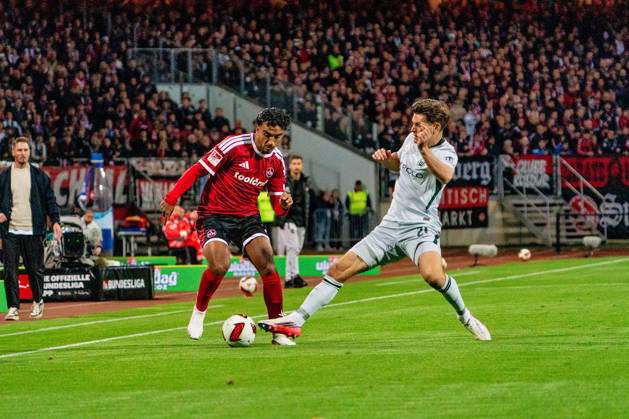 Rayan Ghrieb, 1. FC Nuremberg, 7, and Joakim Maehle, VfL Wolfsburg, 21, GER, 1. FC Nuremberg vs. VfL Wolfsburg, soccer, 2. Bundesliga, Matchday 7, 2026–2027 season, October 10, 2026, DFL regulations prohibit any use of photographs as image sequences and or quasi-video, GER, 1. FC Nuremberg vs. VfL Wolfsburg, Soccer, 2. Bundesliga, Matchday 7, 2026–2027 Season, October 10, 2026, Nuremberg Copyright: xEibner-Pressefoto MaxxVogelx EP_MVL