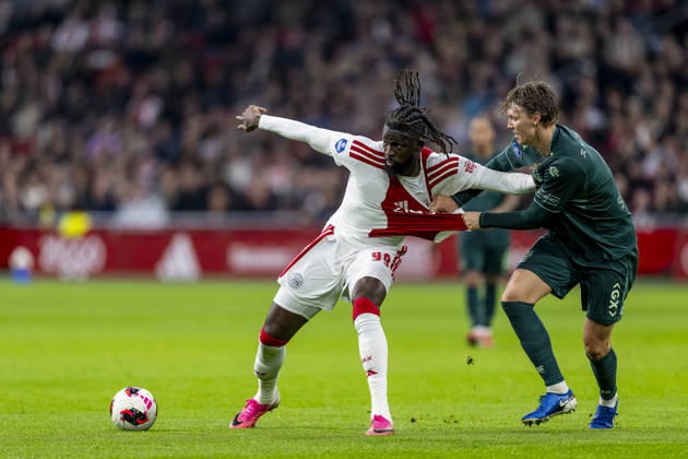 AMSTERDAM l AFC Ajax Amsterdam forward Toluwalase Arokodare and NEC Nijmegen defender Perr Schuurs during the Vriendenloterij Eredivisie match between Ajax and NEC at the Johan Cruijff ArenA on October 10, 2026, in Amsterdam, the Netherlands. Photo by DeFodi Images