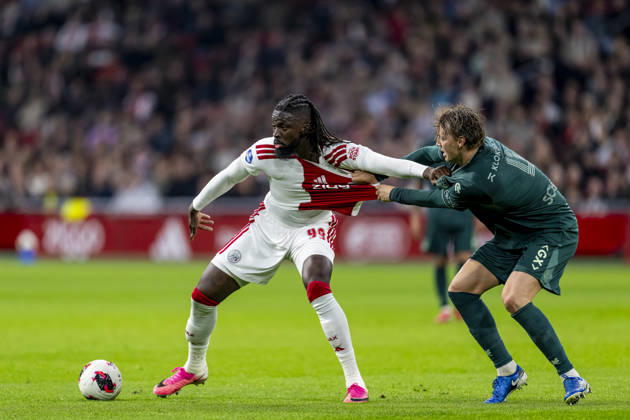 AMSTERDAM l AFC Ajax Amsterdam forward Toluwalase Arokodare and NEC Nijmegen defender Perr Schuurs during the Vriendenloterij Eredivisie match between Ajax and NEC at the Johan Cruijff ArenA on October 10, 2026, in Amsterdam, the Netherlands. Photo by DeFodi Images