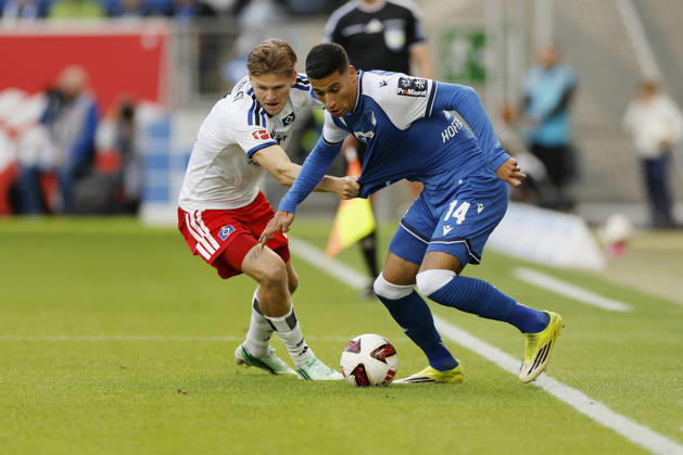 From left to right: Adam Daghim of TSG Hoffenheim and David Moller Wolfe of HSV, in the Bundesliga match between TSG 1899 Hoffenheim and Hamburger SV at the PreZero Arena, Sinsheim, Germany, on October 10, 2026, in action during the Bundesliga match between TSG 1899 Hoffenheim and Hamburger SV at the PreZero Arena, Sinsheim, Germany, on October 10, 2026. DFB and DFL regulations prohibit any use of photographs as image sequences and or quasi-video, Copyright: HMBxMedia xHeikoxBecker