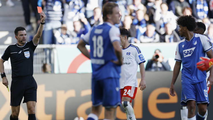 Referee Harm Osmers shows Bernardo of TSG Hoffenheim a yellow-red card—red card, ejection, two-yellow-card dismissal—during the Bundesliga match between TSG 1899 Hoffenheim and Hamburger SV at the PreZero Arena, Sinsheim, Germany, on October 10, 2026, in action during the Bundesliga match between TSG 1899 Hoffenheim and Hamburger SV at the PreZero Arena, Sinsheim, Germany, on October 10, 2026. DFB and DFL regulations prohibit any use of photographs as image sequences and or quasi-video, Copyright: HMBxMedia xHeikoxBecker