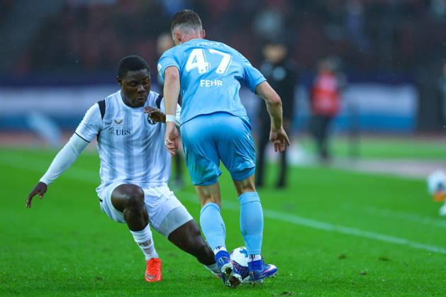 FC Zurich vs. FC Thun, Brack Super League, October 10, 2026: Umeh Emmanuel (11, FC Zurich) in a tackle with Fabio Fehr (47, FC Thun) during the Brack Super League soccer match, FC Zurich vs. FC Thun, October 10, 2026, Letzigrund Stadium, Zurich, Switzerland Zurich Letzigrund Stadium Zurich Switzerland