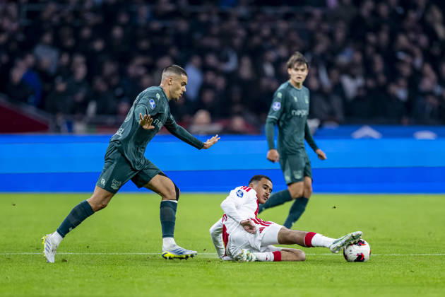 AMSTERDAM l NEC Nijmegen defender Gabriel Bras and AFC Ajax Amsterdam midfielder Abdellah Ouazane during the Vriendenloterij Eredivisie match between Ajax and NEC at the Johan Cruijff ArenA on October 10, 2026, in Amsterdam, Netherlands. Photo by DeFodi Images