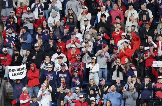 Cleveland Guardians fans cheer for their team as they have the bases loaded against the Chicago White Sox in the eighth inning of an MLB, Baseball Herren, USA American League Division Series at Progressive Field in Cleveland, Ohio, on Saturday, October 10, 2026.  CLE20261010738 AARONxJOSEFCZYK