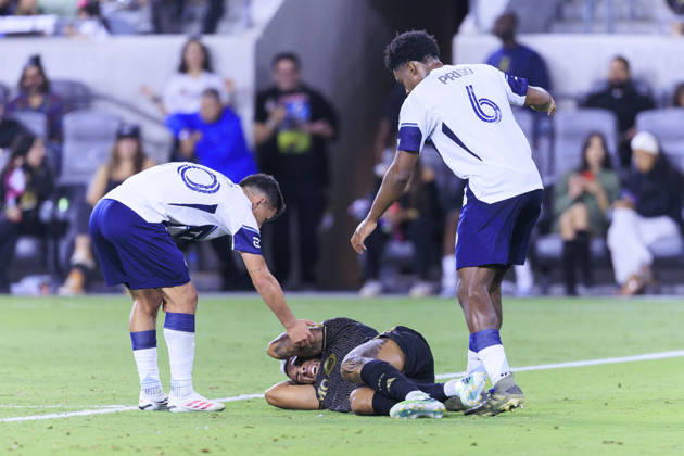 October 10, 2026, Los Angeles, California, USA: Andres Cubas 20 and Ralph Priso-Mbongue 6 of the Vancouver Whitecaps check on Denis Bouanga 99 of the Los Angeles Football Club after a head collision during their regular season MLS, Fussball Herren, USA game on Saturday October 10, 2026 at the BMO Stadium in Los Angeles, California. LAFC tie with Whitecaps, 1-1. ARIANA RUIZ PI LAFC Vs. Vancouver Whitecaps - ZUMAp124 20261010_zaa_p124_015 Copyright: xArianaxRuizx
