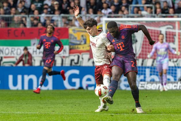 Rodrigo Ribeiro (FC Augsburg) and Dayot Upamecano (FC Bayern Munich) in a tackle, FC Augsburg vs. FC Bayern Munich, Bundesliga, Soccer, Bundesliga 1, Matchday 5, October 10, 2026. DFL regulations prohibit any use of photographs as image sequences and or quasi-video. Copyright: xkolbert-press PeterxFastlx