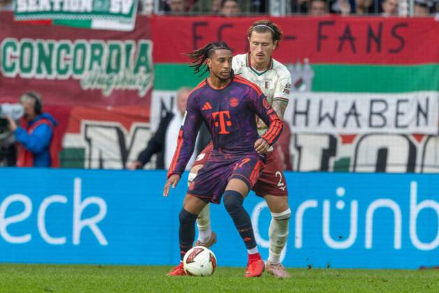 Michael Olise of FC Bayern Munich and Calvin Brackelmann of FC Augsburg in a one-on-one duel, FC Augsburg vs. FC Bayern Munich, Bundesliga, Soccer, Bundesliga 1, Matchday 5, October 10, 2026. DFL regulations prohibit any use of photographs as image sequences and or quasi-video. Copyright: xkolbert-press PeterxFastlx