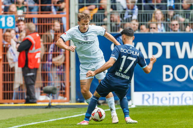 Felix Hagmann of DSC Arminia Bielefeld and Gerrit Holtmann of VfL Bochum battle for the ball during the 2. Bundesliga match between VfL Bochum and Arminia Bielefeld at Ruhrstadion on October 11, 2026, in Bochum, Germany. Photo by Mario Hommes, DeFodi Images. Felix Hagmann of DSC Arminia Bielefeld and Gerrit Holtmann of VfL Bochum battle for the ball during the 2. Bundesliga match between VfL Bochum and Arminia Bielefeld at Vonovia Ruhrstadion on October 11, 2026 in Bochum, Germany Photo by Mario Hommes, DeFodi Images. DFB and DFL regulations prohibit any use of photographs as image sequences and or quasi-video. Photo by Mario Hommes, DeFodi Images