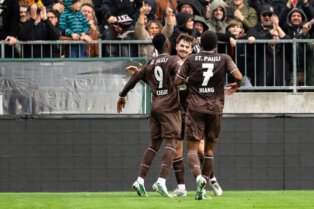 Goal to make it 1–0: Abdoulie Ceesay (FC St. Pauli, 09) celebrates with Connor Metcalfe (FC St. Pauli, 24) and Youssoupha Niang (FC St. Pauli, 07, GER, FC St. Pauli vs. Karlsruher SC, soccer, 2. Bundesliga, Matchday 7, 2026–2027 season, October 11, 2026 DFL regulations prohibit any use of photographs as image sequences and or quasi-video GER, FC St. Pauli vs. Karlsruher SC, soccer, 2. Bundesliga, Matchday 7, 2026–2027 season, October 11, 2026, Hamburg Copyright: xEibner-Pressefoto MaxxVincenx EP_MVN