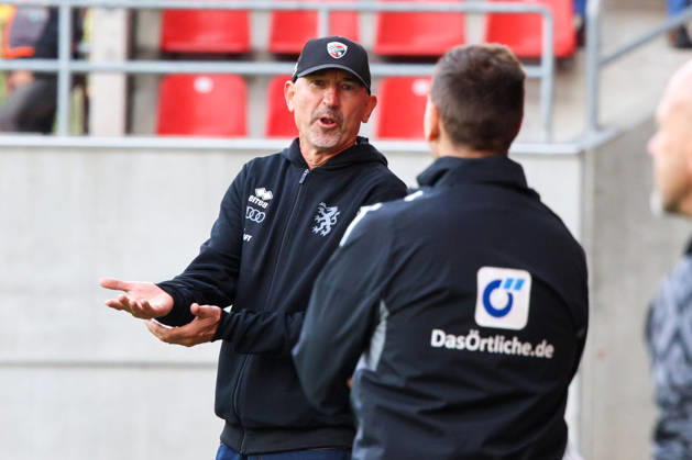 Coach Achim Beierlorzer, head coach of FC Ingolstadt 04, is seen discussing with the fourth official during the match between FC Ingolstadt 04 and SV Wehen Wiesbaden on October 11, 2026, DFB regulations prohibit any use of photographs as image sequences and or quasi-video. GER, Soccer, 3. Liga, Matchday 8, FC Ingolstadt 04 vs. SV Wehen Wiesbaden, October 11, 2026, Audi Sportpark Ingolstadt Copyright: xEibner-Pressefoto OliverxSTRISCHx EP-OSH