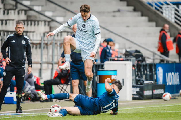 Bochum, Germany October 11, 2026 2. Bundesliga 2026–2027 Matchday 7 VfL Bochum 1848 vs. DSC Arminia Bielefeld Pictured from left in a tackle: Joel Grodowski (DSC) and Gerrit Holtmann (BOC). DFL and DFB regulations prohibit any use of photographs as image sequences and or quasi-video. Vonovia Ruhrstadion, North Rhine-Westphalia Copyright: xFotostandx xGraebex