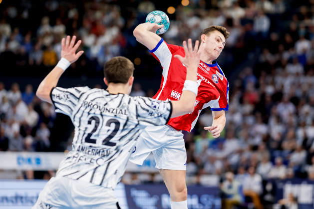Kiel, October 11, 2026; Handball, 1st Bundesliga 2026–27, THW Kiel vs. Handball Club Hamburg; Rasmus Ankermann (THW Kiel, 22), Nicolaj Jörgensen (HC Hamburg, 11)