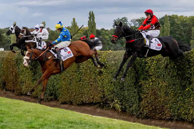The 136th Grand Pardubice Steeplechase (6,900m), in Pardubice, Czech Republic, on October 11, 2026. The horses are crossing the Taxis Ditch. From the right: Adam Cmiel on Caryjape and James Best on Greek Dessert. (CTKxPhoto DavidxTanecek) CTKPhotoP2026101104510 CTKPhotoP2026101104510