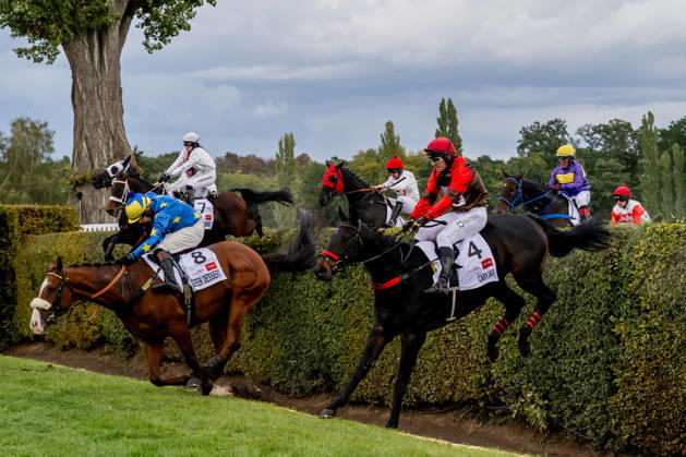 The 136th Grand Pardubice Steeplechase (6,900m), in Pardubice, Czech Republic, on October 11, 2026. The horses cross the Taxis Ditch. In the front, from the right, Adam Cmiel on Caryjape and James Best on Greek Dessert. (CTKxPhoto DavidxTanecek) CTKPhotoP2026101104519 CTKPhotoP2026101104519