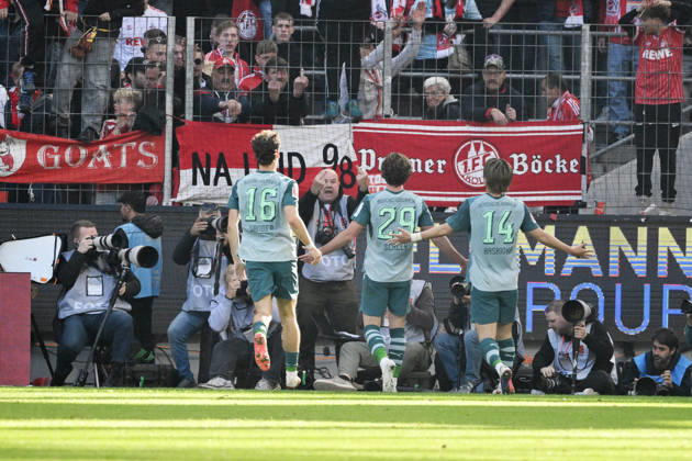 Joe Scally of Borussia Mönchengladbach, center, celebrates in front of the Cologne fan section; in the background, a photographer makes an offensive gesture. October 11, 2026, Soccer, Bundesliga, 2026–2027 season, Matchday 5, 1. FC Köln vs. Borussia Mönchengladbach. DFL regulations prohibit any use of photographs as image sequences and or quasi-video. Cologne, RheinEnergie Stadium, North Rhine-Westphalia, Germany Team2