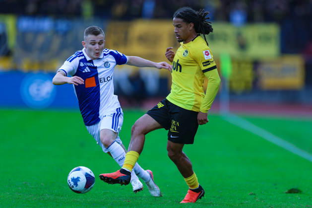 GC Zurich vs. BSC Young Boys, Brack Super League, October 11, 2026: Isaac Schmidt, 22, BSC Young Boys, right, and Samuel Krasniqi, 17, Grasshopper Club Zurich, in the Brack Super League match between Grasshopper Club Zurich (GCZ) and BSC Young Boys (YB) on October 11, 2026, at Letzigrund Stadium in Zurich, Switzerland; Zurich, Letzigrund Stadium, Zurich, Switzerland