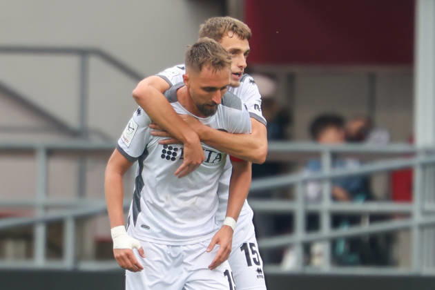 Ingolstadt, Germany, October 11, 2026, 3rd League 2026–2027, Matchday 8: FC Ingolstadt 04 vs. SV Wehen Wiesbaden. Pictured from left: goal scorer Florian Hübner (Huebner) of SVWW celebrating after his goal to make it 0–1 with Justin Janitzek of SVWW. DFB DFL regulations prohibit any use of photographs as image sequences and or quasi-video Copyright: xFotostandx xSchäferx