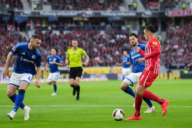 1 Bundesliga: SC Freiburg vs. FC Schalke 04, October 11, 2026; Tackle between Hasan Kurucay (FC Schalke 04, No. 4) and Derry Scherhant (SC Freiburg, No. 7); 1 Bundesliga: SC Freiburg vs. FC Schalke 04, Europa-Park Stadium, October 11, 2026 DFB and DFL regulations prohibit any use of photographs as image sequences and or quasi-video. Copyright: xBEAUTIFULxSPORTS Boscox