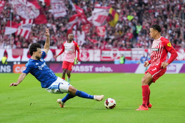 1 Bundesliga: SC Freiburg vs. FC Schalke 04, October 11, 2026—A tackle between Adrian Gantenbein (FC Schalke 04, No. 17) and Derry Scherhant (SC Freiburg, No. 7). 1 Bundesliga: SC Freiburg vs. FC Schalke 04, Europa-Park Stadium, October 11, 2026 DFB and DFL regulations prohibit any use of photographs as image sequences and or quasi-video. Copyright: xBEAUTIFULxSPORTS Boscox