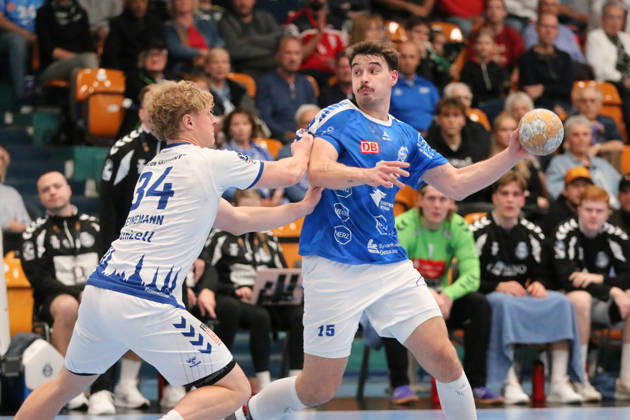 11 10 2026 Men s Handball 2026–2027, 2nd Division, Matchday 7: Dessau Roßlauer HV 06 vs. VfL Lübeck Schwartau at Anhalt Arena, Dessau. Referee: Marcel Nowak (Dessau), 15, in blue, is disrupted on the attack by Thore Heinemann of Lübeck, 34, in white Dessau Roßlau Saxony-Anhalt Germany
