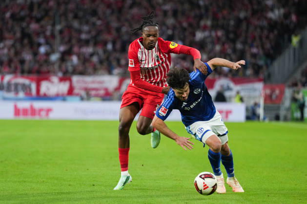 1 Bundesliga: SC Freiburg vs. FC Schalke 04, October 11, 2026—A tackle between Adrian Gantenbein (FC Schalke 04, No. 17) and Jordy Makengo (SC Freiburg, No. 33). 1 Bundesliga: SC Freiburg vs. FC Schalke 04, Europa-Park Stadium, October 11, 2026 DFB and DFL regulations prohibit any use of photographs as image sequences and or quasi-video. Copyright: xBEAUTIFULxSPORTS Boscox