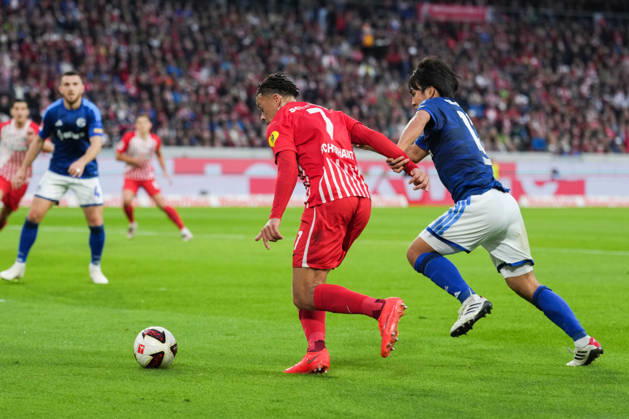 1 Bundesliga: SC Freiburg vs. FC Schalke 04, October 11, 2026—A tackle between Satoshi Tanaka (FC Schalke 04, No. 13) and Derry Scherhant (SC Freiburg, No. 7). 1 Bundesliga: SC Freiburg vs. FC Schalke 04, Europa-Park Stadium, October 11, 2026 DFB and DFL regulations prohibit any use of photographs as image sequences and or quasi-video. Copyright: xBEAUTIFULxSPORTS Boscox