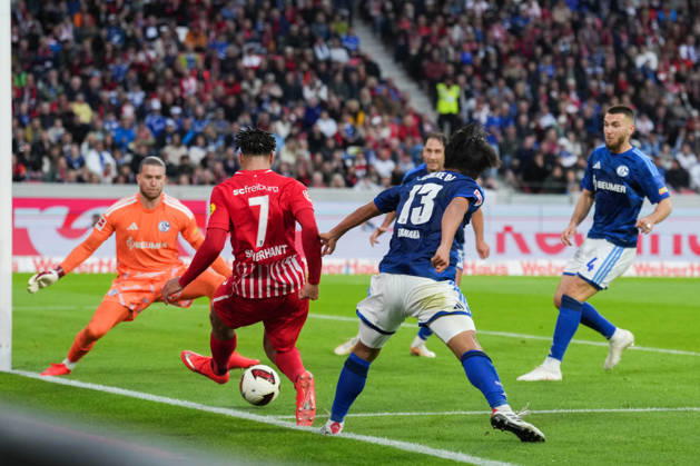 1 Bundesliga: SC Freiburg vs. FC Schalke 04, October 11, 2026—A tackle between Satoshi Tanaka (FC Schalke 04, No. 13) and Derry Scherhant (SC Freiburg, No. 7). 1 Bundesliga: SC Freiburg vs. FC Schalke 04, Europa-Park Stadium, October 11, 2026 DFB and DFL regulations prohibit any use of photographs as image sequences and or quasi-video. Copyright: xBEAUTIFULxSPORTS Boscox