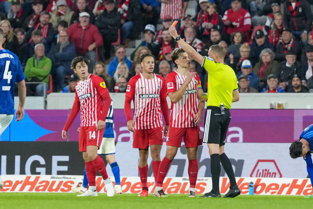 Referee Martin Petersen shows Yuito Suzuki of SC Freiburg, No. 14, a yellow-red card; Germany, soccer, Bundesliga 1, Matchday 5, 2026–2027, SC Freiburg vs. FC Schalke 04, October 11, 2026, Europa-Park Stadium, Freiburg, Baden-Württemberg, Germany Copyright: xArnexAmbergx