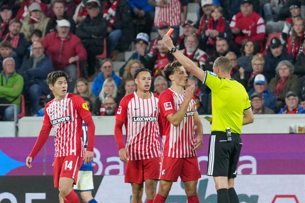 Referee Martin Petersen shows Yuito Suzuki of SC Freiburg, No. 14, a yellow-red card; Germany, soccer, Bundesliga 1, Matchday 5, 2026–2027, SC Freiburg vs. FC Schalke 04, October 11, 2026, Europa-Park Stadium, Freiburg, Baden-Württemberg, Germany Copyright: xArnexAmbergx