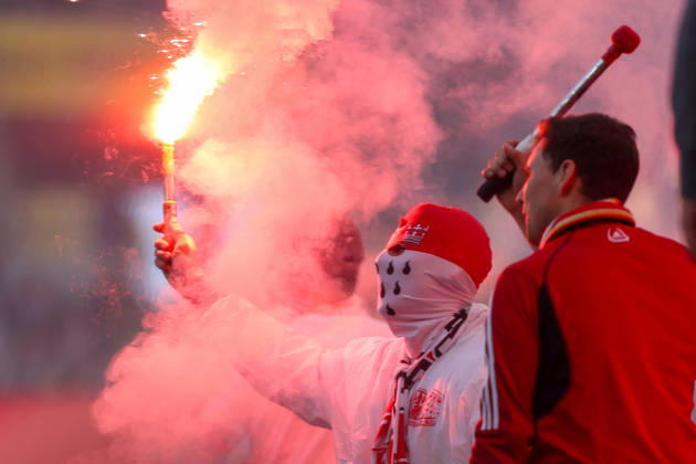 October 11, 2026, xkwix, Soccer, Bundesliga, 1. FC Köln vs. Borussia Mönchengladbach, RheinEnergieSTADION, Matchday 5, 2026–2027 season. A masked Cologne fan holding a flares. DFB regulations prohibit the use of photographs as image sequences and or quasi-video. Photo: xKamilxWilkowskixPressefotoKochx, North Rhine-Westphalia, Germany