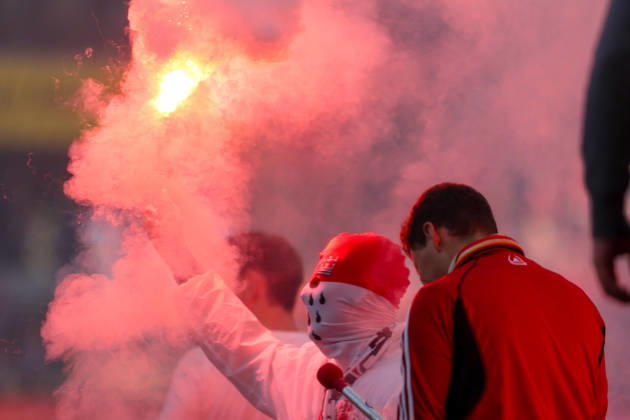 October 11, 2026, xkwix, Soccer, Bundesliga, 1. FC Köln vs. Borussia Mönchengladbach, RheinEnergieSTADION, Matchday 5, 2026–2027 season. A masked Cologne fan holding a flares. DFB regulations prohibit the use of photographs as image sequences and or quasi-video. Photo: xKamilxWilkowskixPressefotoKochx, North Rhine-Westphalia, Germany