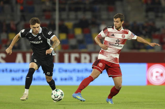 Tim Heike of SC Verl and Tim Oberdorf of Fortuna Düsseldorf battle for the ball during the 3. Liga match between Fortuna Düsseldorf and SC Verl at Merkur Spiel Arena on October 11, 2026, in Düsseldorf, Germany. Photo by Oliver Kaelke, DeFodi Images. Tim Heike of SC Verl and Tim Oberdorf of Fortuna Düsseldorf battle for the ball during the 3. Liga match between Fortuna Düsseldorf and SC Verl at Merkur Spiel Arena on October 11, 2026 in Düsseldorf, Germany. Photo by Oliver Kaelke, DeFodi Images. DFB and DFL regulations prohibit any use of photographs as image sequences and or quasi-video. Photo by Oliver Kaelke, DeFodi Images.