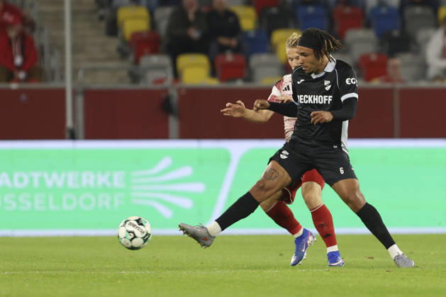 Joshua Eze of SC Verl and Andreas Mueller of Fortuna Düsseldorf battle for the ball during the 3. Liga match between Fortuna Düsseldorf and SC Verl at the Merkur Spiel Arena on October 11, 2026, in Düsseldorf, Germany. Photo by Oliver Kaelke, DeFodi Images. Joshua Eze of SC Verl and Andreas Mueller of Fortuna Düsseldorf battle for the ball during the 3. Liga match between Fortuna Düsseldorf and SC Verl at Merkur Spiel Arena on October 11, 2026 in Düsseldorf, Germany. Photo by Oliver Kaelke, DeFodi Images. DFB and DFL regulations prohibit any use of photographs as image sequences and or quasi-video. Photo by Oliver Kaelke, DeFodi Images.
