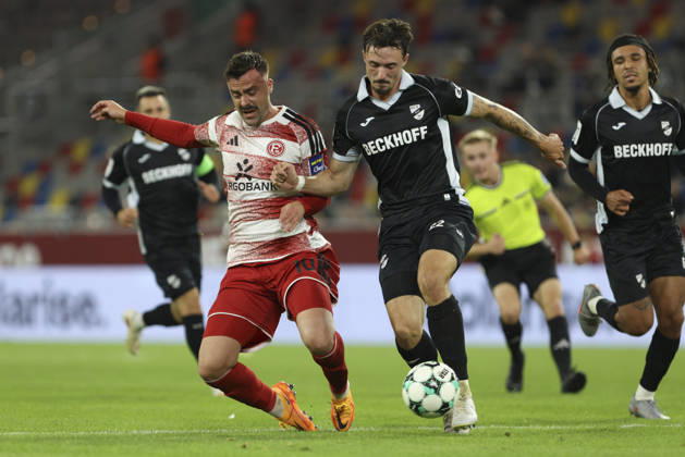 Philipp Foerster of Fortuna Düsseldorf and Noah Koenig of SC Verl battle for the ball during the 3. Liga match between Fortuna Düsseldorf and SC Verl at Merkur Spiel Arena on October 11, 2026, in Düsseldorf, Germany. Photo by Oliver Kaelke, DeFodi Images. Philipp Foerster of Fortuna Düsseldorf and Noah Koenig of SC Verl battle for the ball during the 3. Liga match between Fortuna Düsseldorf and SC Verl at Merkur Spiel Arena on October 11, 2026 in Düsseldorf, Germany. Photo by Oliver Kaelke, DeFodi Images. DFB and DFL regulations prohibit any use of photographs as image sequences and or quasi-video. Photo by Oliver Kaelke, DeFodi Images.