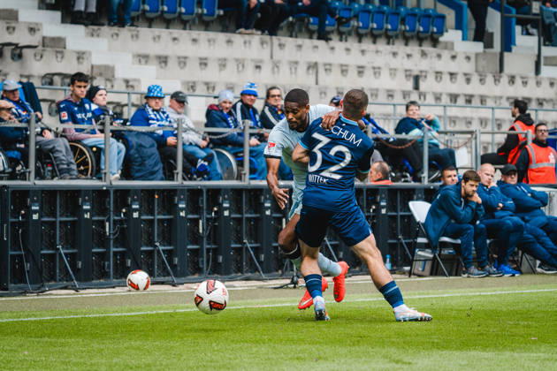Bochum, Germany October 11, 2026 2. Bundesliga 2026–2027 Matchday 7 VfL Bochum 1848 vs. DSC Arminia Bielefeld Pictured, from left, in a tackle: Isaiah Young (DSC) and Maximilian Wittek (BOC). DFL and DFB regulations prohibit any use of photographs as image sequences and or quasi-video Vonovia Ruhrstadion, North Rhine-Westphalia Copyright: xFotostandx xGraebex