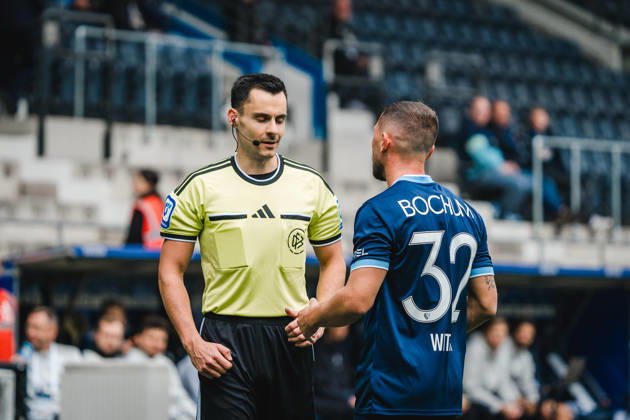 Bochum, Germany, October 11, 2026, 2. Bundesliga 2026–2027, Matchday 7: VfL Bochum 1848 vs. DSC Arminia Bielefeld. Pictured, from left: Referee Konrad Oldhafer and Maximilian Wittek (BOC) in conversation after a foul. DFL DFB regulations prohibit any use of photographs as image sequences and or quasi-video. Vonovia Ruhrstadion, North Rhine-Westphalia Copyright: xFotostandx xGraebex